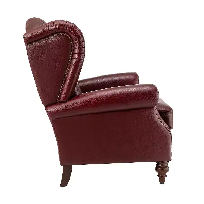 Poltrona a pozzetto larga 84 cm in vera pelle con gambe coniche in legno massello e bordo con borchie