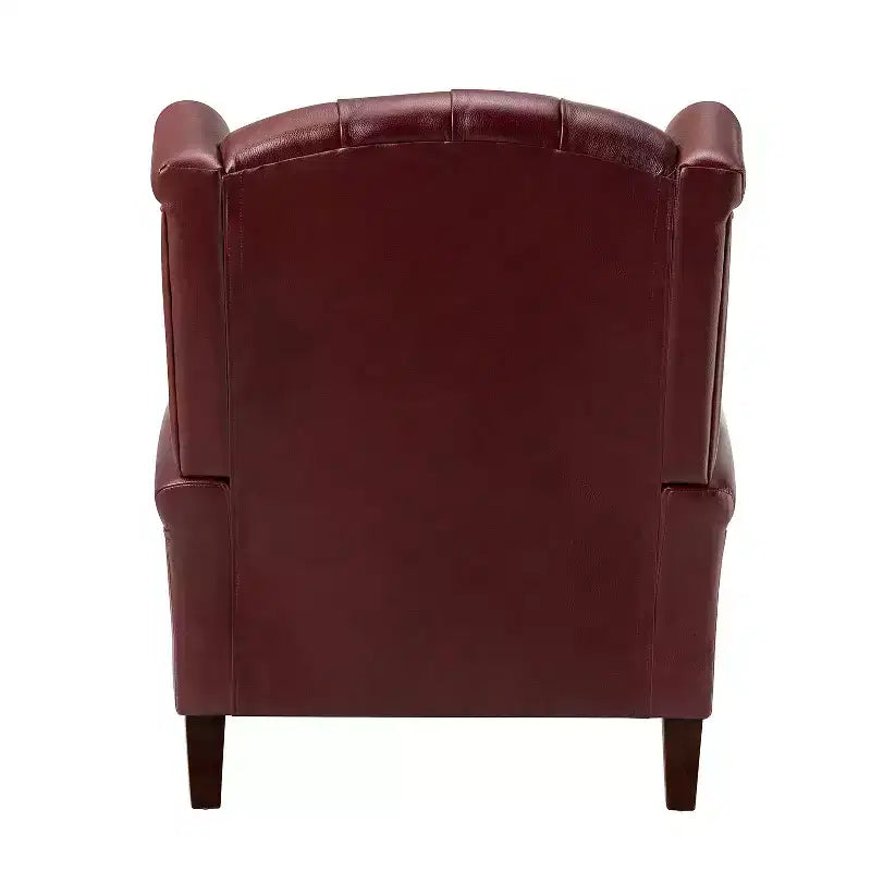 Poltrona a pozzetto larga 84 cm in vera pelle con gambe coniche in legno massello e bordo con borchie