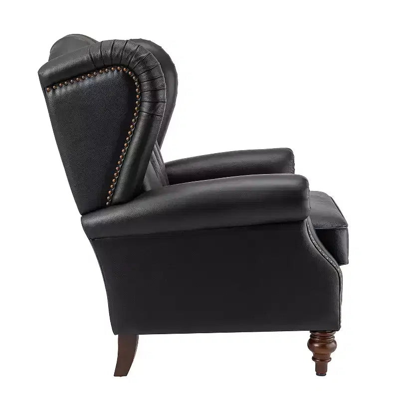 Poltrona a pozzetto larga 84 cm in vera pelle con gambe coniche in legno massello e bordo con borchie