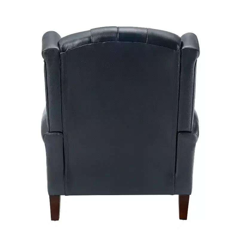 Poltrona a pozzetto larga 84 cm in vera pelle con gambe coniche in legno massello e bordo con borchie