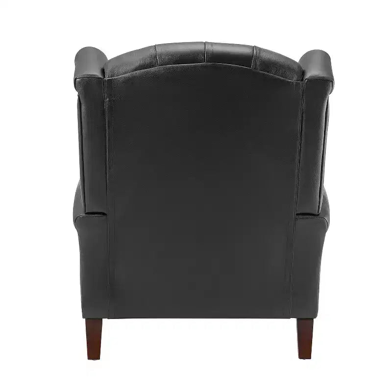 Poltrona a pozzetto larga 84 cm in vera pelle con gambe coniche in legno massello e bordo con borchie