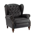 Poltrona a pozzetto larga 84 cm in vera pelle con gambe coniche in legno massello e bordo con borchie